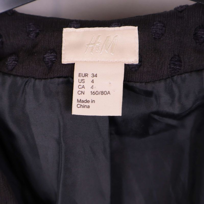 H&M storleksetikett med information om storlek