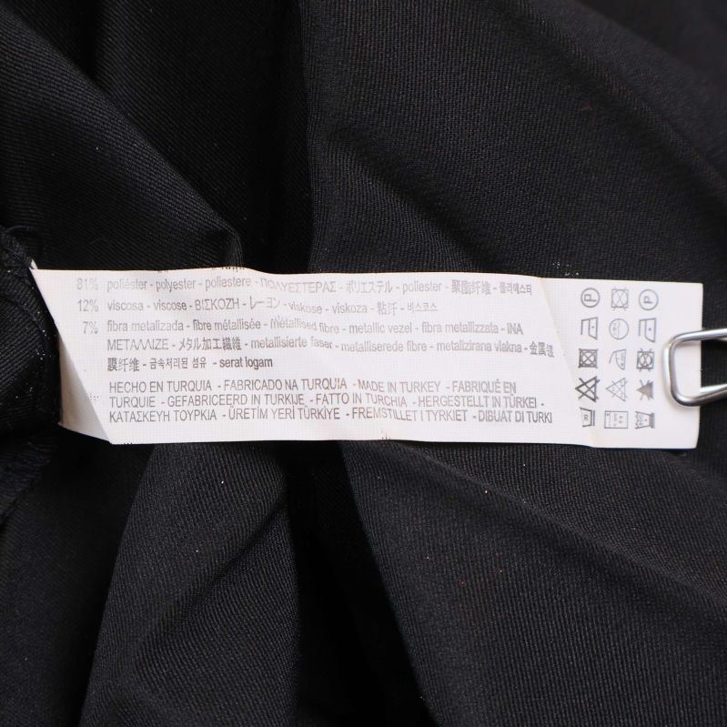 Materialetikett med blandning av viskos, polyester, metallfiber och elastan