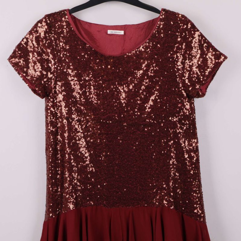 Övre del av klänning med glänsande paljetter och rund hals