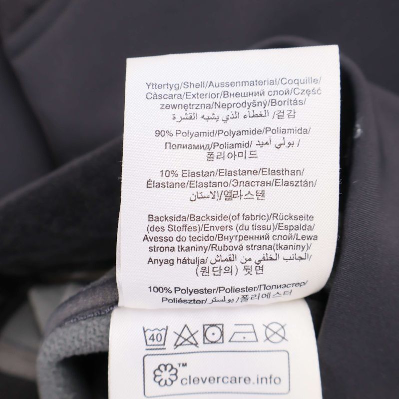 Materiallapp som visar byxans komposition och tvättråd