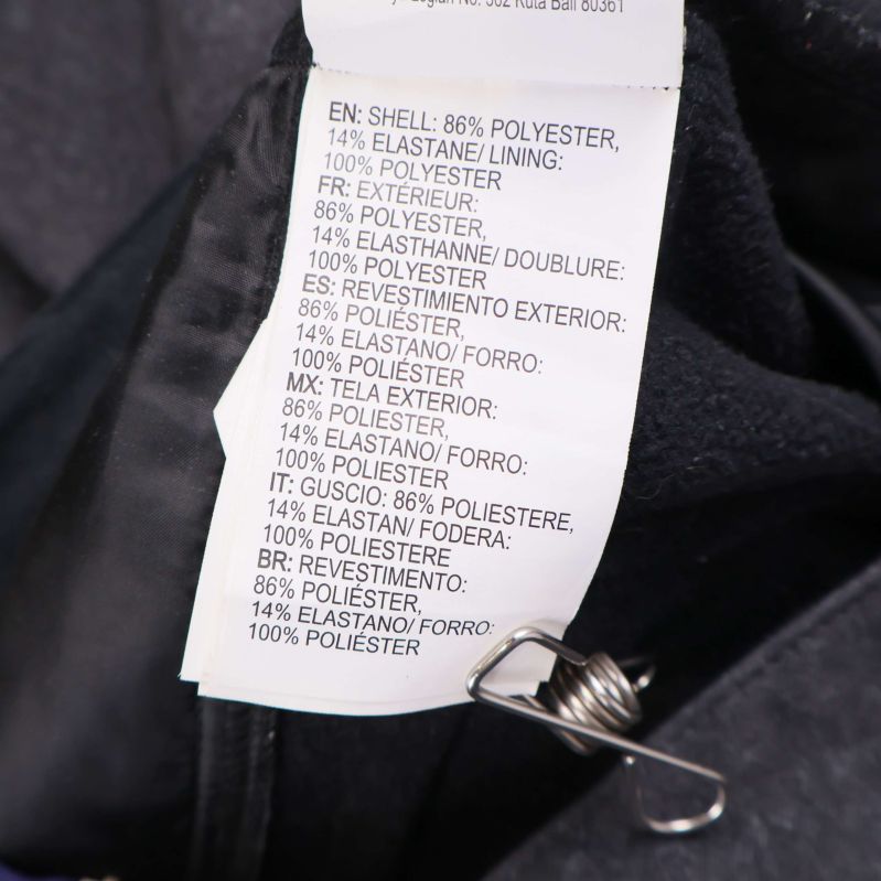 Materialetikett visar polyester och elastan sammansättning