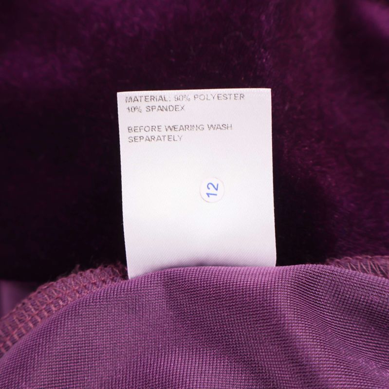 Materiallapp visar 90% polyester och 10% spandex