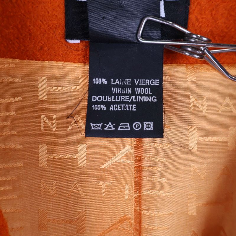 Materiallapp visar 100% ull och 100% acetatfoder