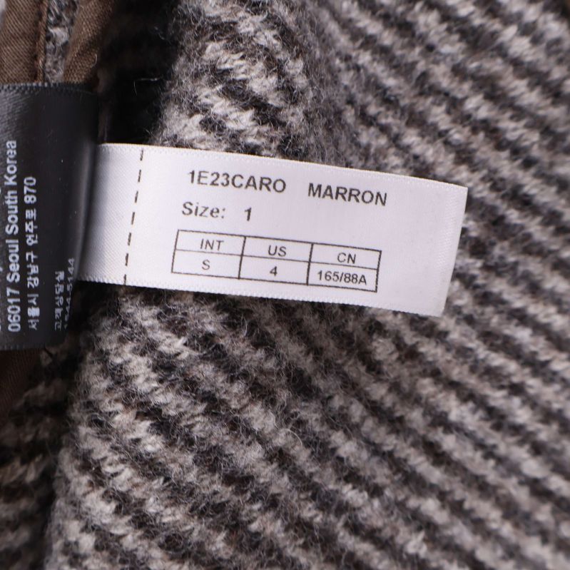 Storleksetikett som visar storlek 1 och färg MARRON