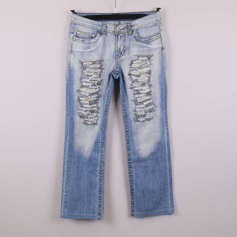 Jeans med slitningar, paljetter och raka ben framifrån