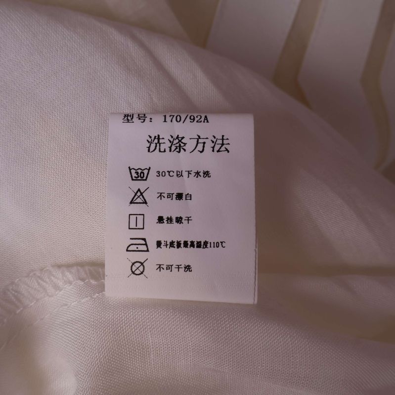 Tvättetikett med instruktioner