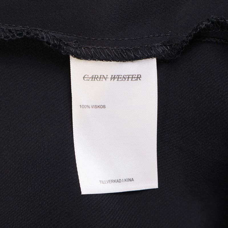 Materialetikett 100% viskos Carin Wester