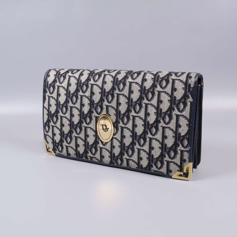 Väska med monogrammönster utan axelrem som clutch