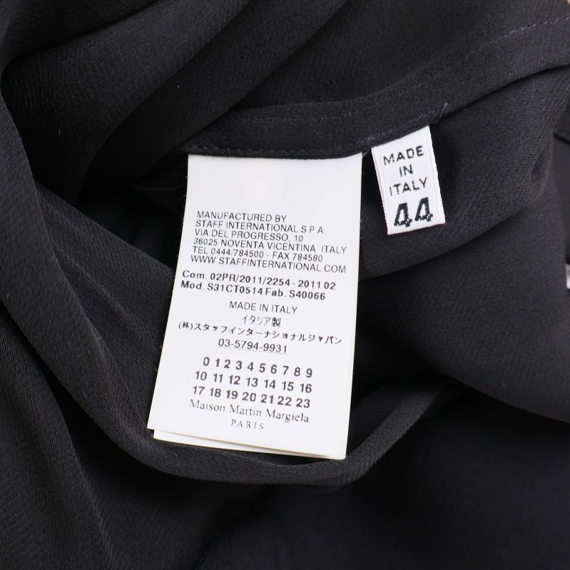 Materiallapp visar ullsammansättning och storlek 44