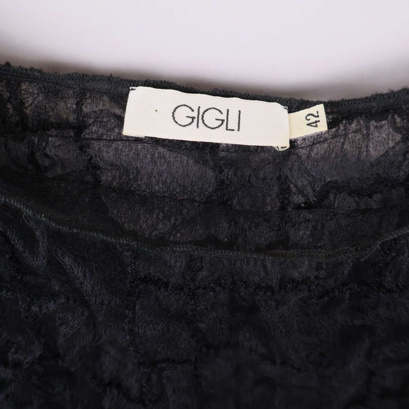 Närbild på etikett med märkning Gigli storlek 42