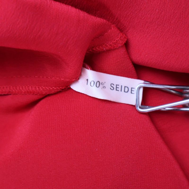 Materiallapp med texten 100% Seide