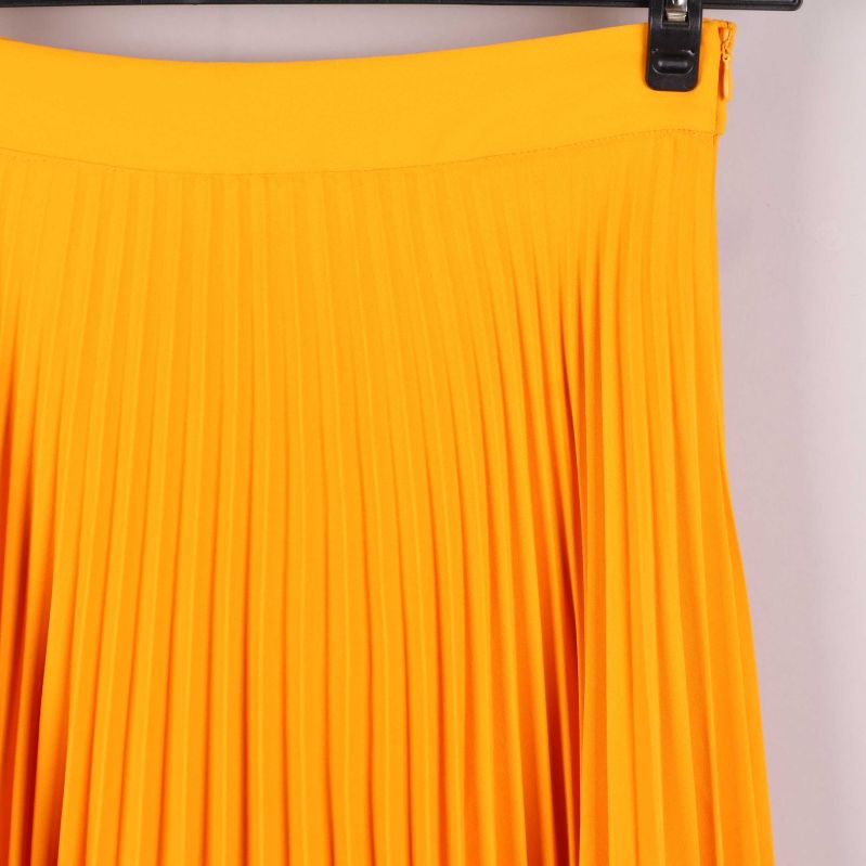 Kjolens övre plisserade detalj