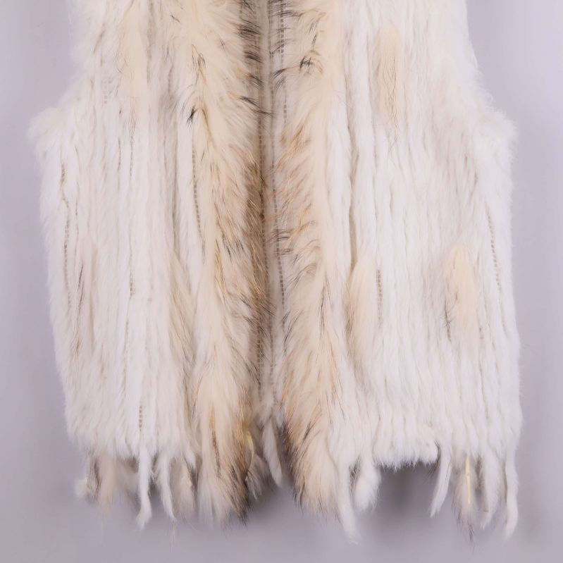 Nedre del av pälsväst med fransad kant
