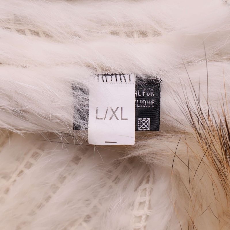 Storleksetikett L/XL inuti pälsväst