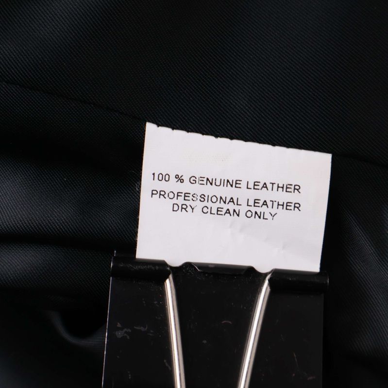 Materiallapp med texten 100% genuine leather