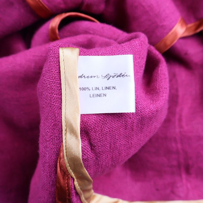 Materiallapp med text 100% lin