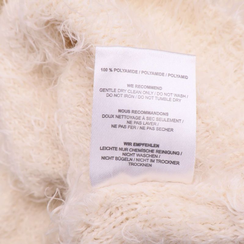 Materialetikett med texten 100% polyamid