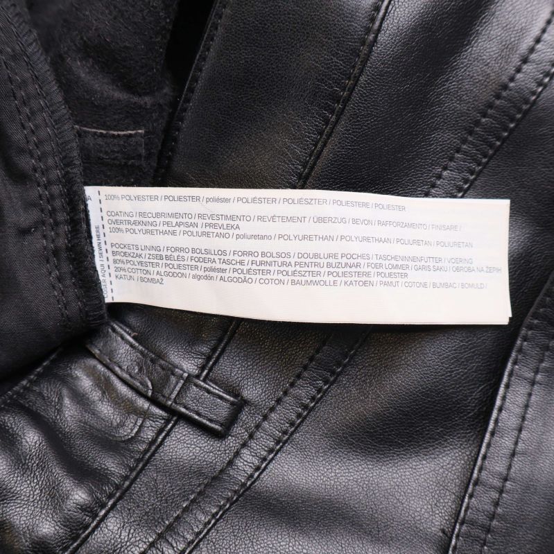 Materialetikett med detaljerad sammansättning för byxorna