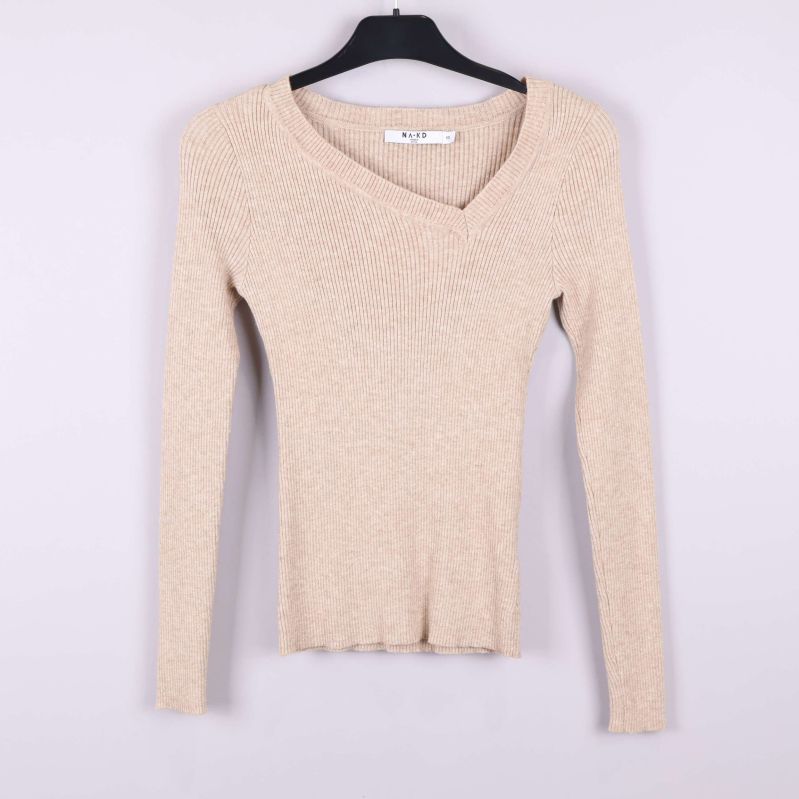 Ribbstickad tröja i beige