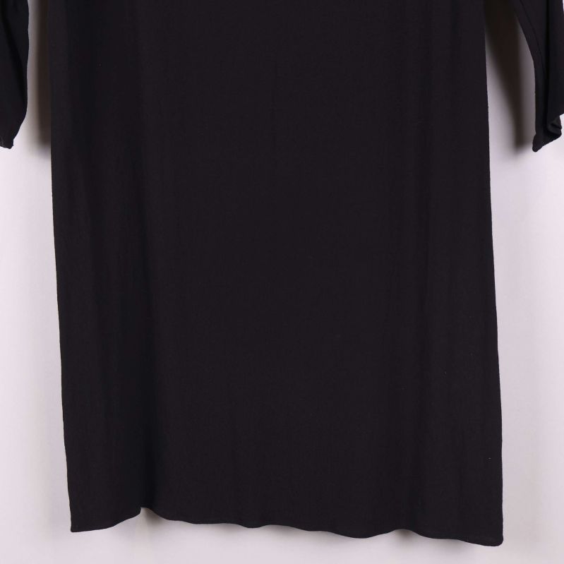 Nyckelhålsdetalj vid halsen