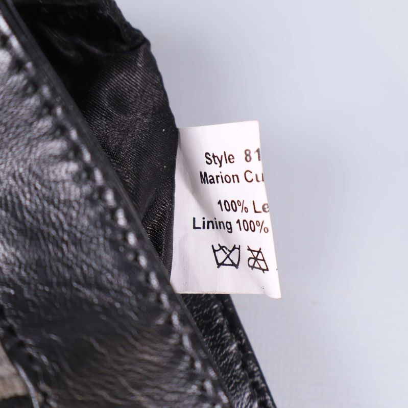 Materiallapp med information om 100% läder och polyesterfoder