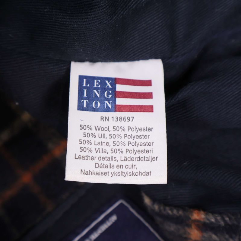 Materiallapp med information om 50% ull, 50% polyester och läderdetaljer