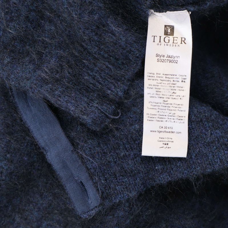 Materiallapp med Tiger of Sweden och materialinformation