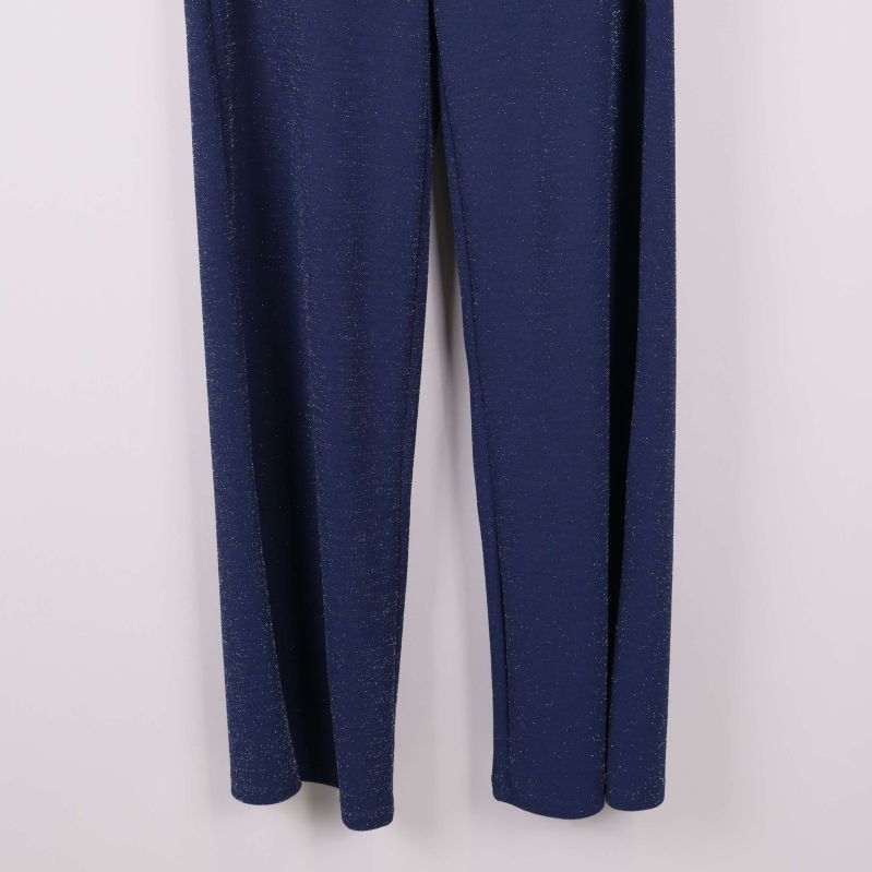 Benavslut på blå glittriga byxor med glitterdetaljer