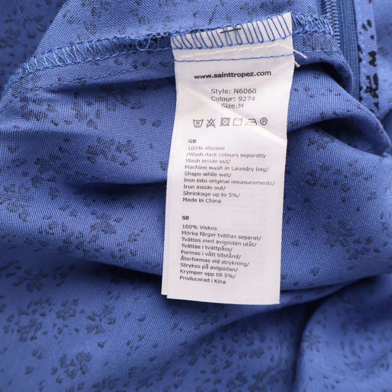 Materialetikett som visar 100 procent viskos