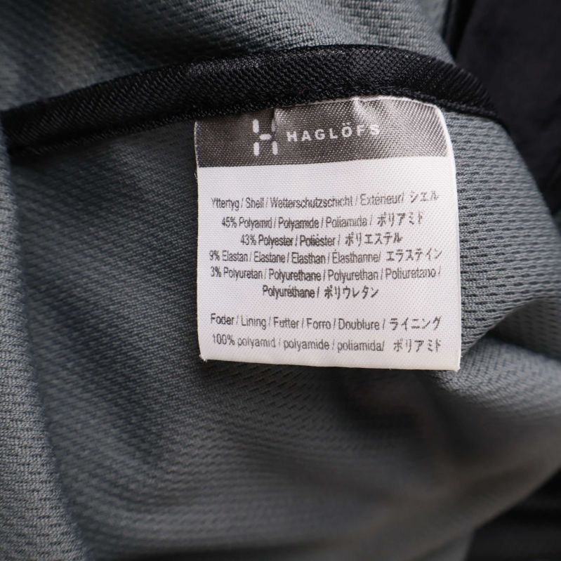 Materiallapp visar byxornas materialkomposition