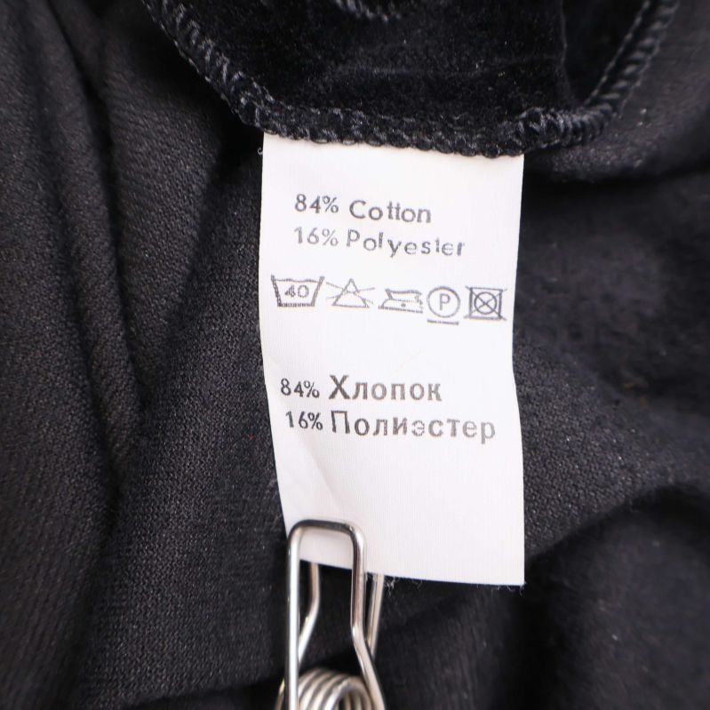 Materialetikett med information om bomull och polyester