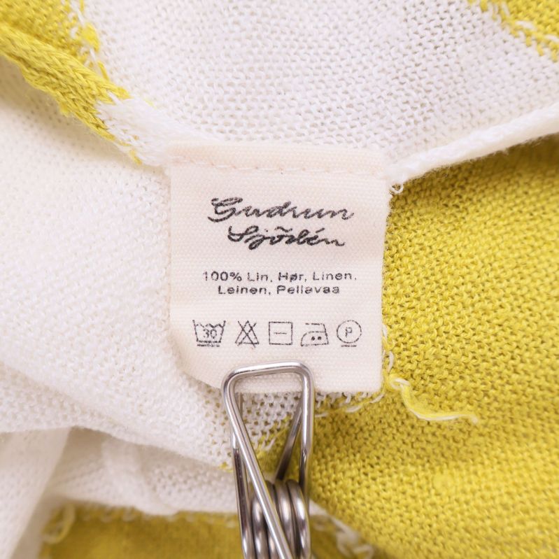 Materiallapp med info om 100% lin och tvättråd