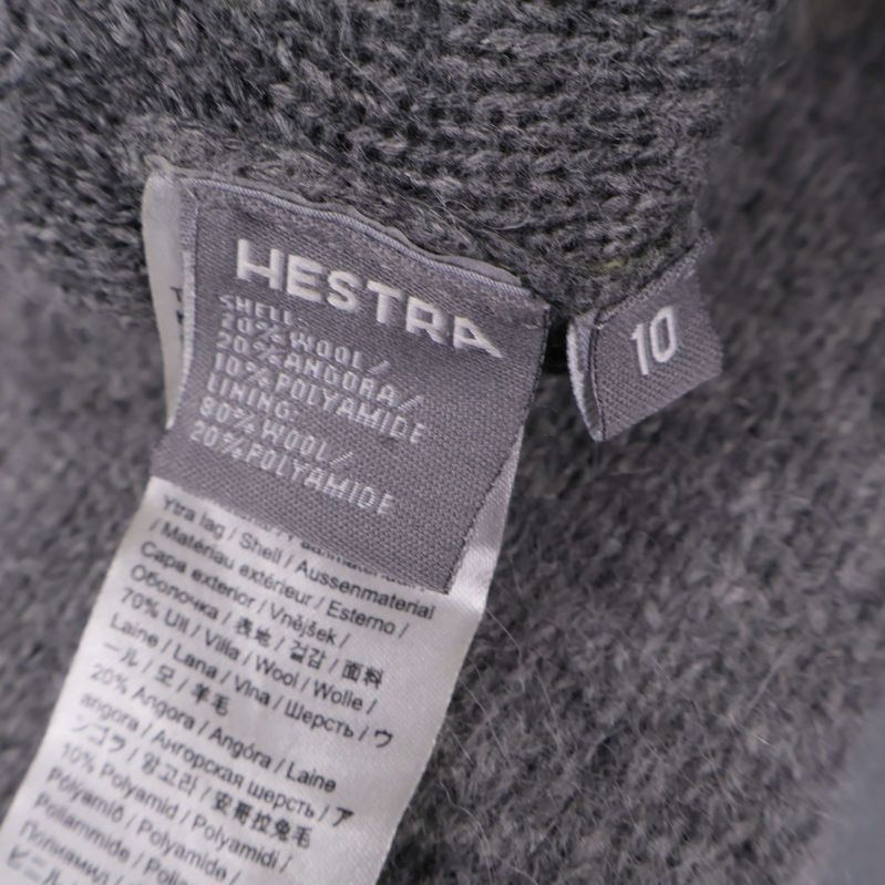 Materialetikett som visar sammansättningen av lammull, angora och polyamid