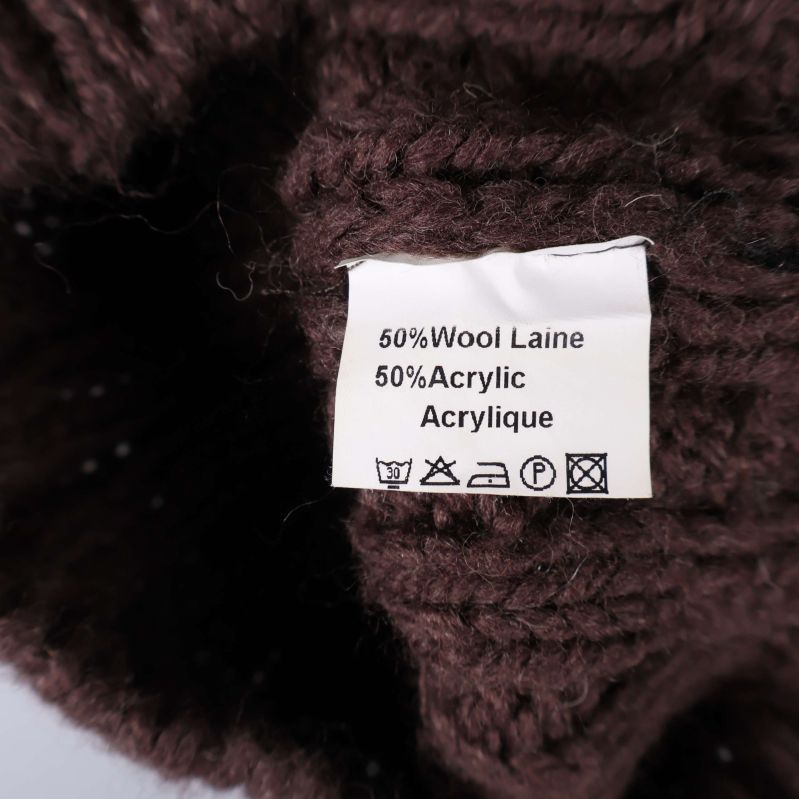 Materiallapp visar innehåll 50% ull och 50% akryl