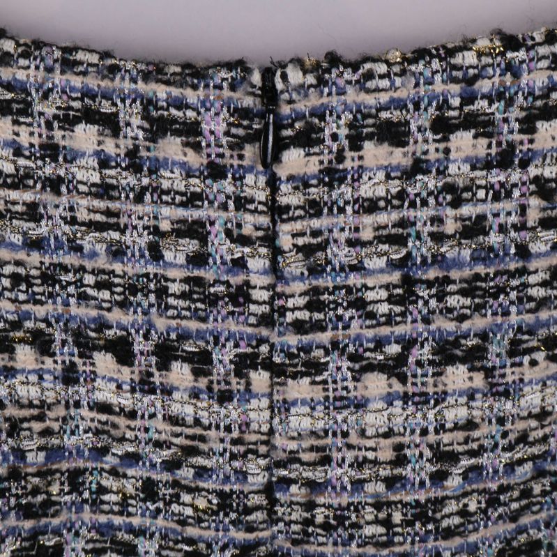 Dold dragkedja baktill i midjan på kjolen