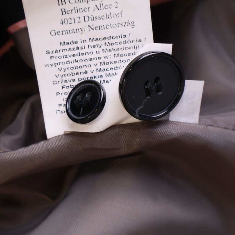 Materialinfo och storlek i kavajen