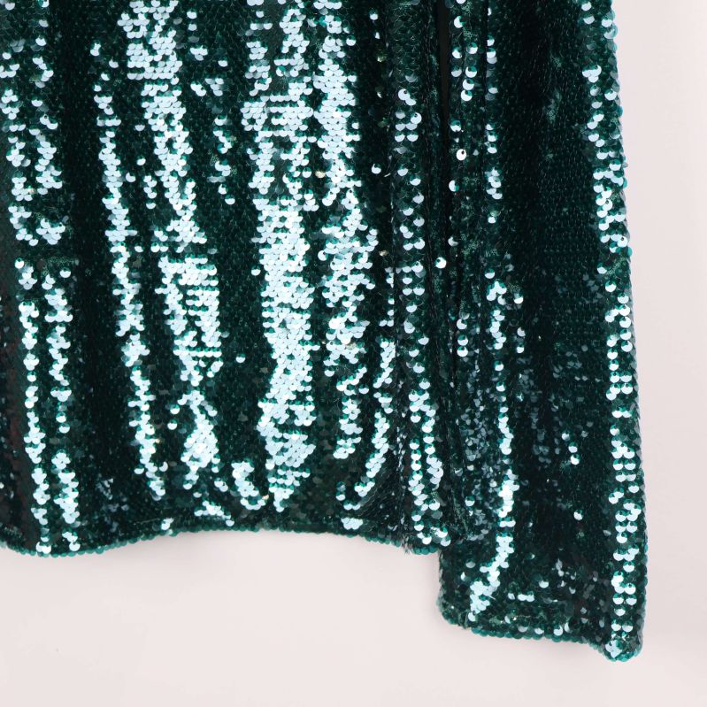 Detaljerad polokrage med paljetter