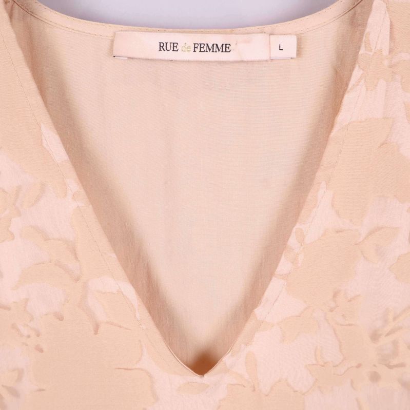 V-ringning och varumärke Rue de Femme