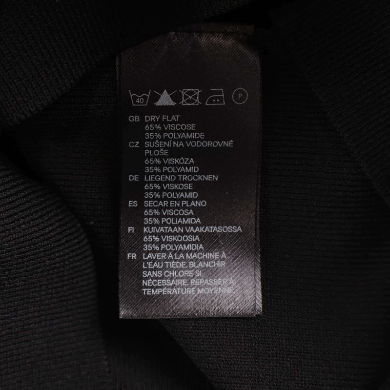 Materiallapp med information om viskos, polyamid och polyester