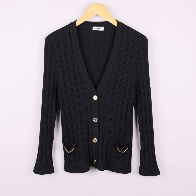 Kofta med guldknappar och fickor