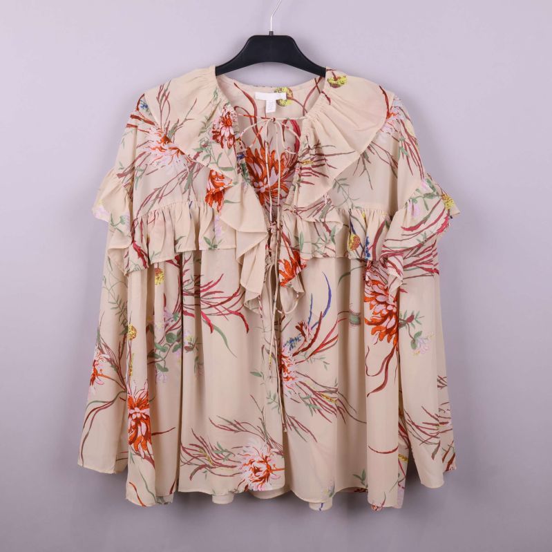 Blus med blommönster