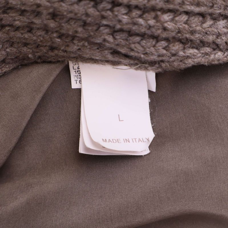 Etikett som visar storlek L och Made in Italy