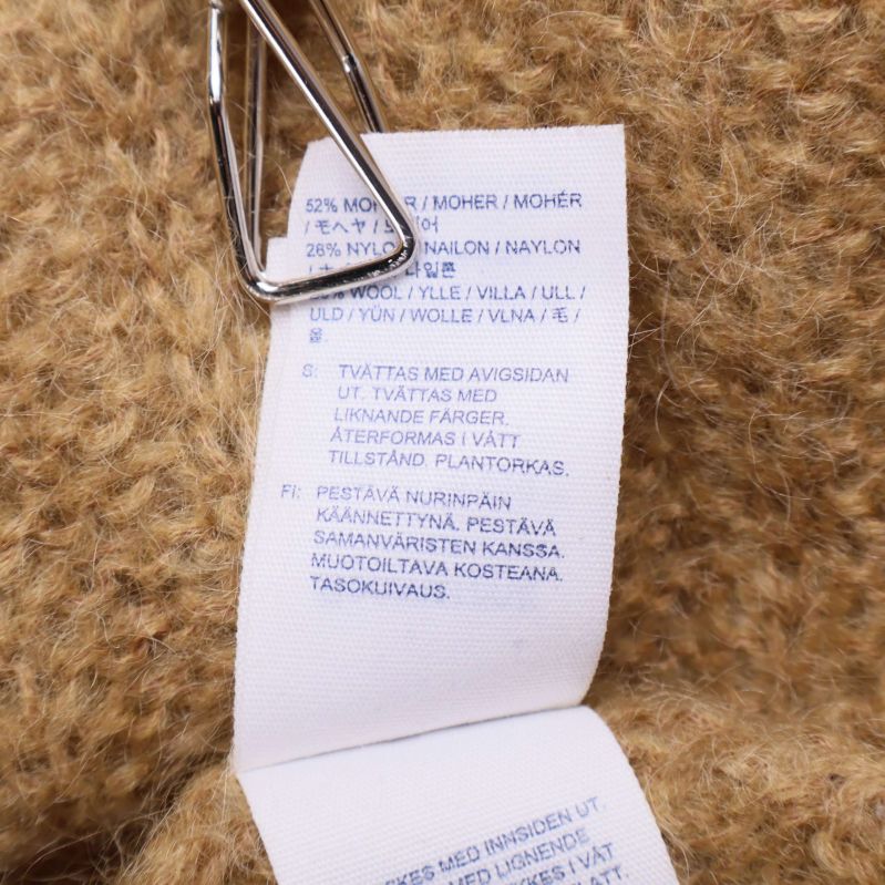 Materialetikett med fiberinnehåll för stickad tröja