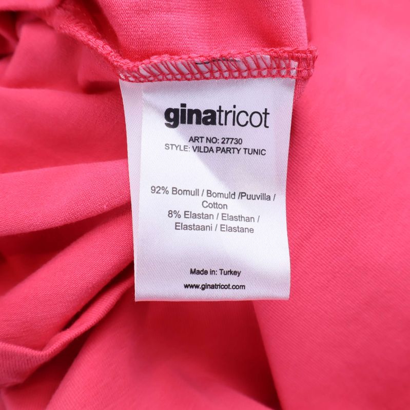 Materiallapp med information om bomull och elastan