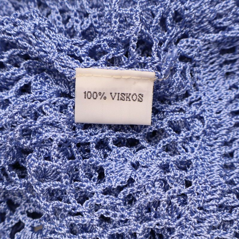 Materialetikett med texten 100% viskos