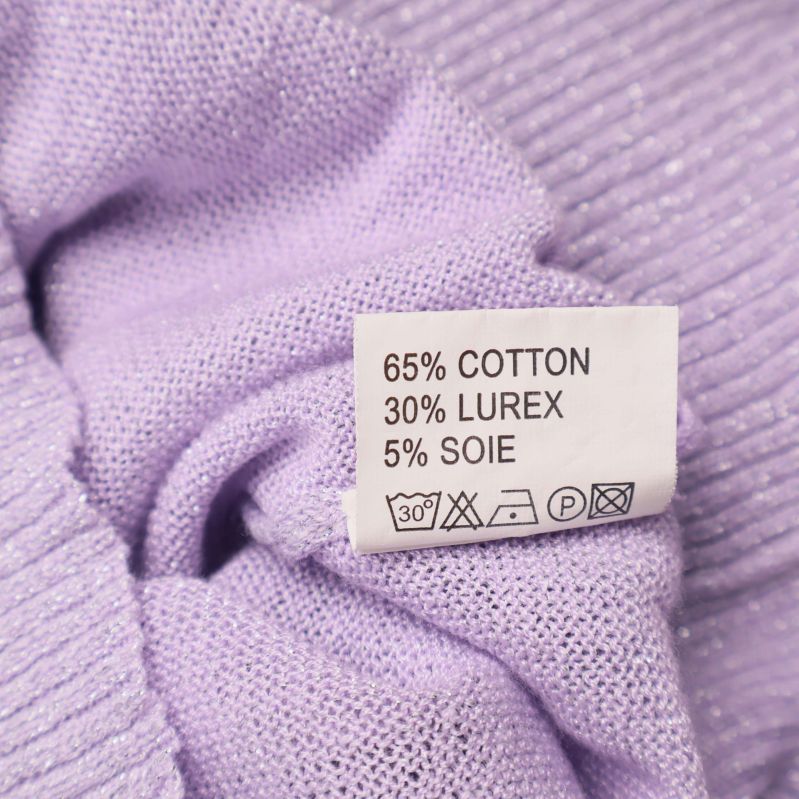 Materialetikett visar 65% bomull, 30% lurex, 5% silke