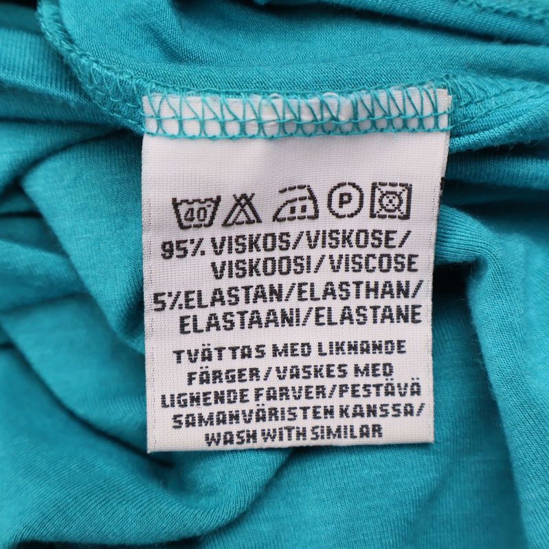 Materialetikett visar 95% viskos och 5% elastan