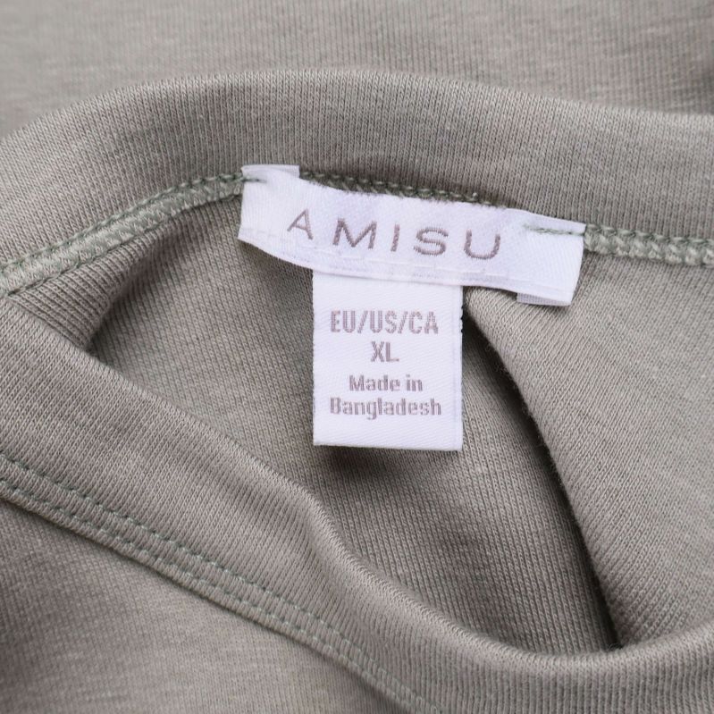Närbild av Amisu-märkesetikett och storlek XL