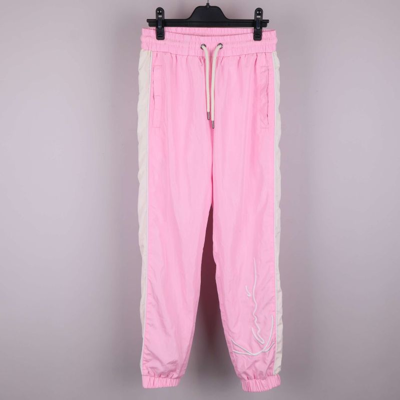 Rosa träningsbyxor med vita sidoränder och dragsko