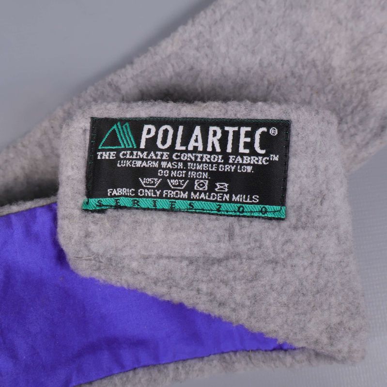 Etikett med POLARTEC-materialinformation på pannbandets insida